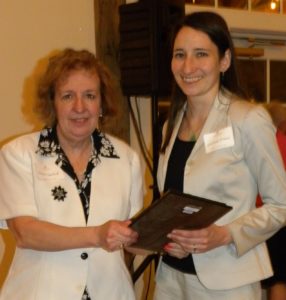 Lancaster attorney Elaine Ugolnik presents the Nast Pro Bono Award to Lindsay O'Neil.